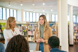 Young student making presentation to classmates and teacher